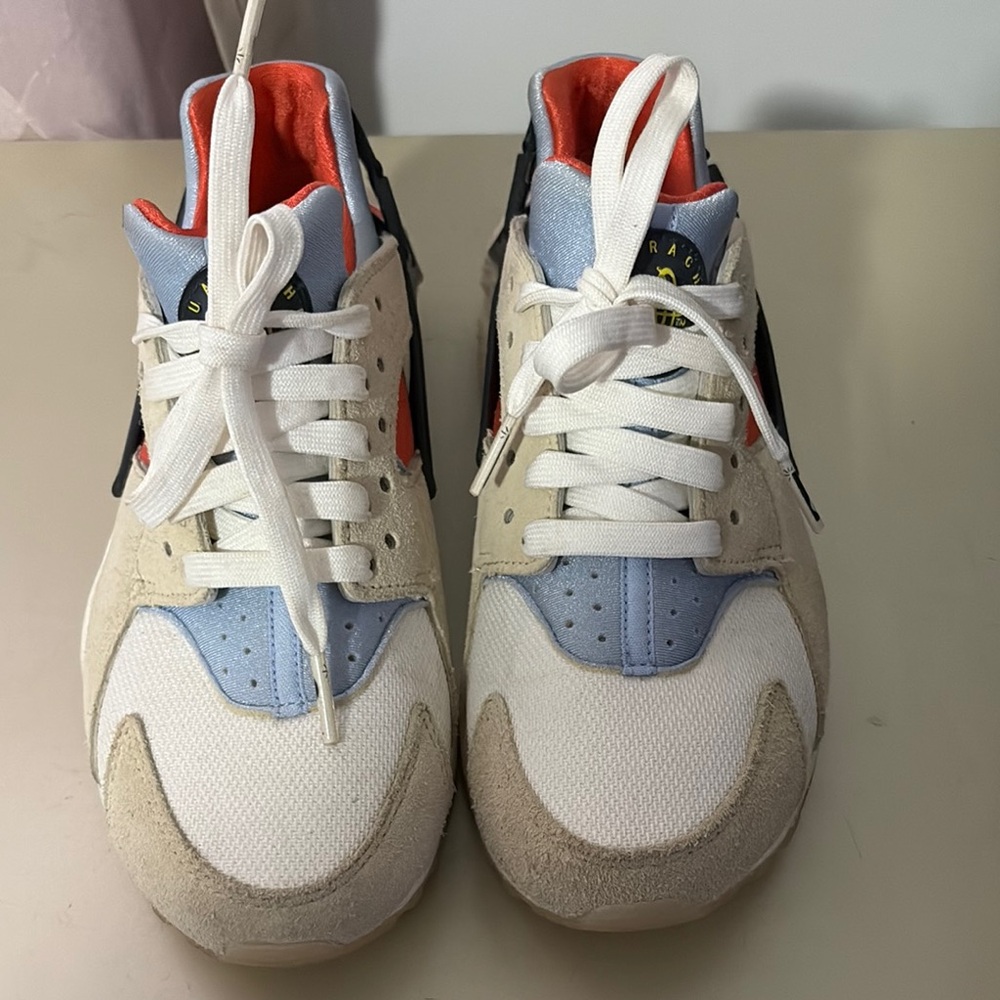 White and Blue Sneakers with Red Accents